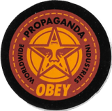 Worldwide Propaganda Industries (Brown) - 1.5"